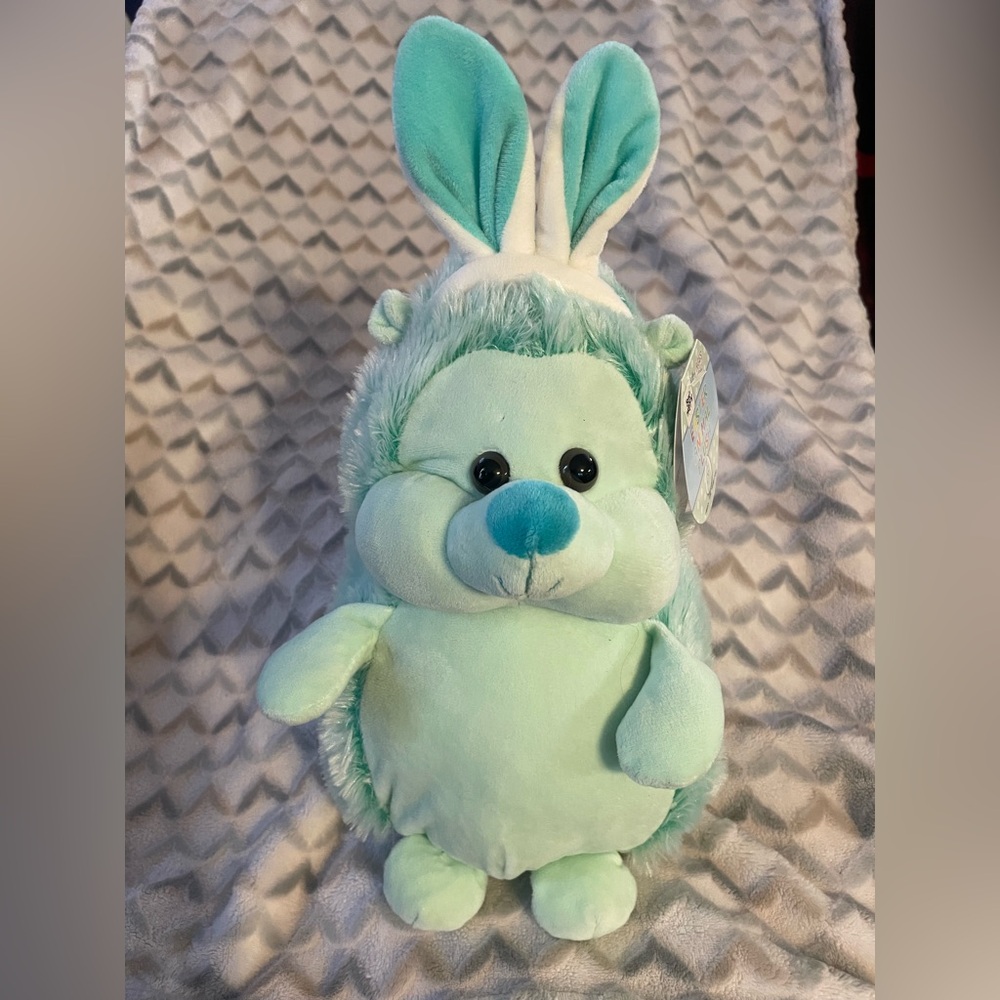 Easter plush toy hedgehog wearing bunny ears fluffy colorful be happy